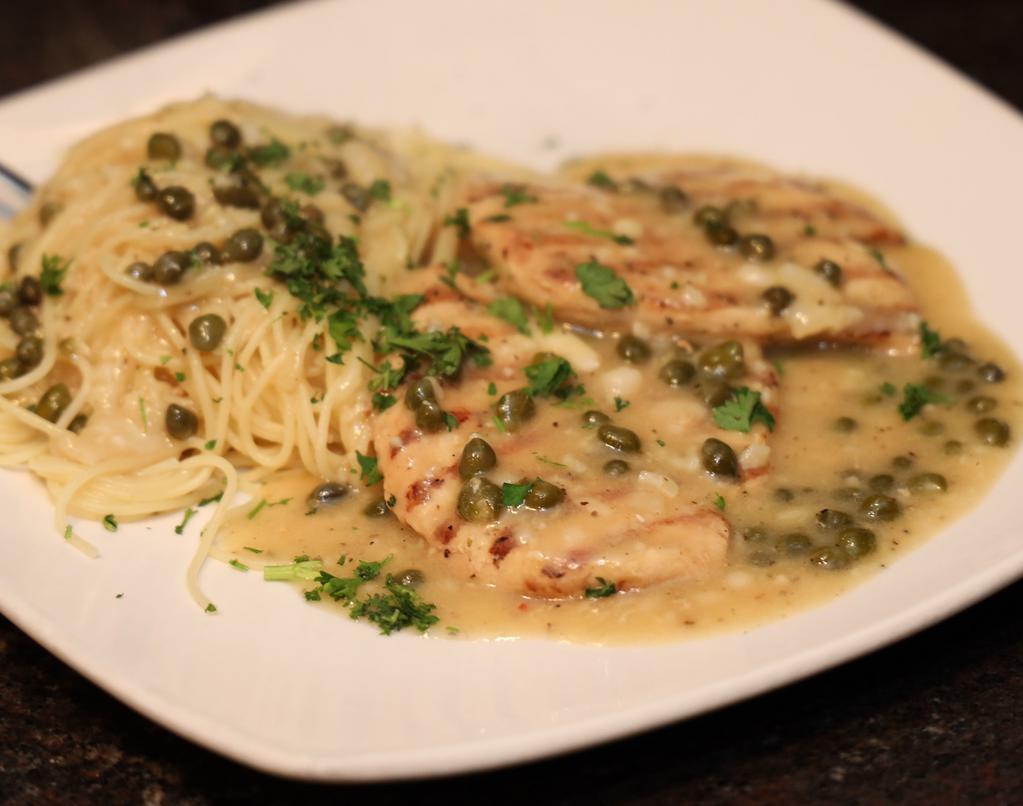 Chicken Piccata · Grilled chicken breast sauteed with capers, in a delicate lemon butter sauce served with angel hair pasta.
