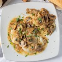 Chicken Angelo · Chicken breast sauteed in a white wine sauce with fresh mushrooms & topped with mozzarella c...