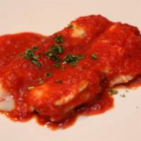 Manicotti (New On Menu) · Two pasta tubes stuffed with ricotta cheese and topped with mozzarella cheese and tomato sau...
