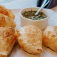 Empanadas 12 Cuts Vegetable Or Cheese (Each) · Homemade Argentinian vegetable Empanadas filled with Squash, onions and parmesan cheese or f...
