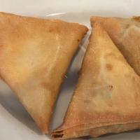 Samosas (3Pc) · Triangular pastries filled with seasoned ground beef and fried for a golden crisp crust.