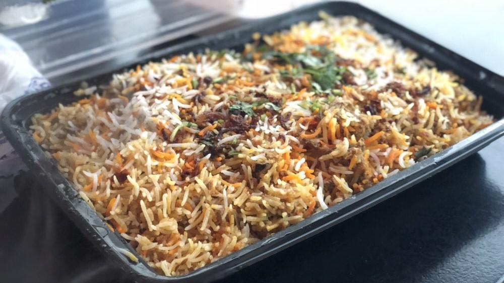 Mutton Biryani · Goat meat marinated in yogurt and traditional spices cooked with basmati rice garnished with saffron.