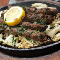 Beef Seekh Kabobs (4Pc) · Ground beef seasoned with onions, garlic, ginger and spices, charbroiled on a skewer and ser...