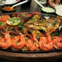 Seafood Platter · Pairing of lahori fish (grilled or fried) with tiger shrimp and caramelized onions.