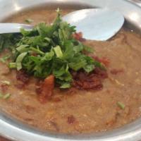 Haleem · Shredded beef and coarse whole-wheat grains cooked overnight and simmered to a medium consis...