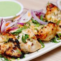 Chicken Malai Boti (8 Pcs) · Boneless chicken cubes marinated with in house blend of herbs yogurt and raw papaya for a te...