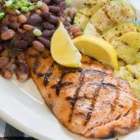 Grilled Salmon Fillet · Served with grilled veggies, beans and rice.