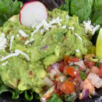 Guacamole · Haas avocados blended with pico de gallo and freshly squeezed lime juice.