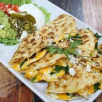 Chicken Fajita & Spinach Quesadillas · Served with guacamole sour cream jalapeños chips and red salsa.