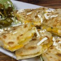 Shrimp Quesadillas · Served with guacamole sour cream jalapeños chips and red salsa.