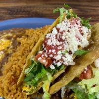 Crispy Tacos - Chicken · Served with mexican rice and beans chips and red salsa.