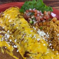 Burrito Classico - Beef Picadillo · Beef picadillo, rolled in a homemade flour tortilla with refried beans and chile con queso. ...