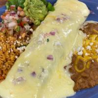 Burrito Monterrey - Chicken Fajita · Homemade flour tortilla stuffed with chicken fajita, refried black beans, chile con queso an...