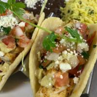 Tacos Del Mar - Mahi · Two delicious tacos with grilled mahi-mahi in homemade corn tortillas. Loaded with escabeche...