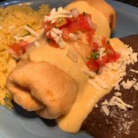 Chimichanga - Shrimp · One chimichanga loaded with shrimp & cheese, lightly fried & topped with our white wine crea...