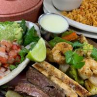 Shrimp (6) & Beef Fajitas · Grilled shrimp, & Beef Fajitas with onions, bell peppers, zucchini and squash.