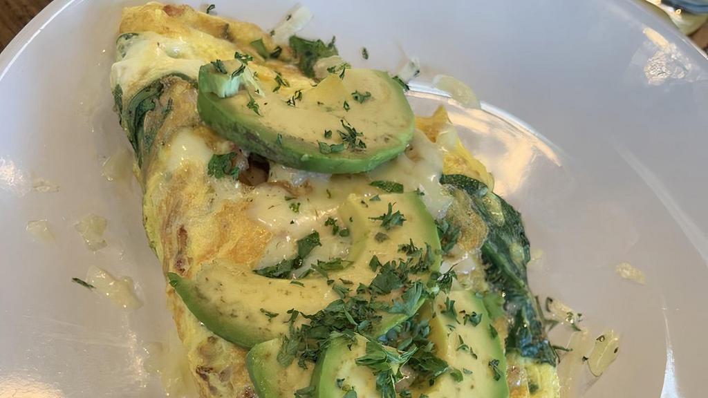Bacado Omelet · Bacon, tomato, spinach, baby Swiss cheese, and topped with avocado. Choice of grits and toast, or roasted potatoes.