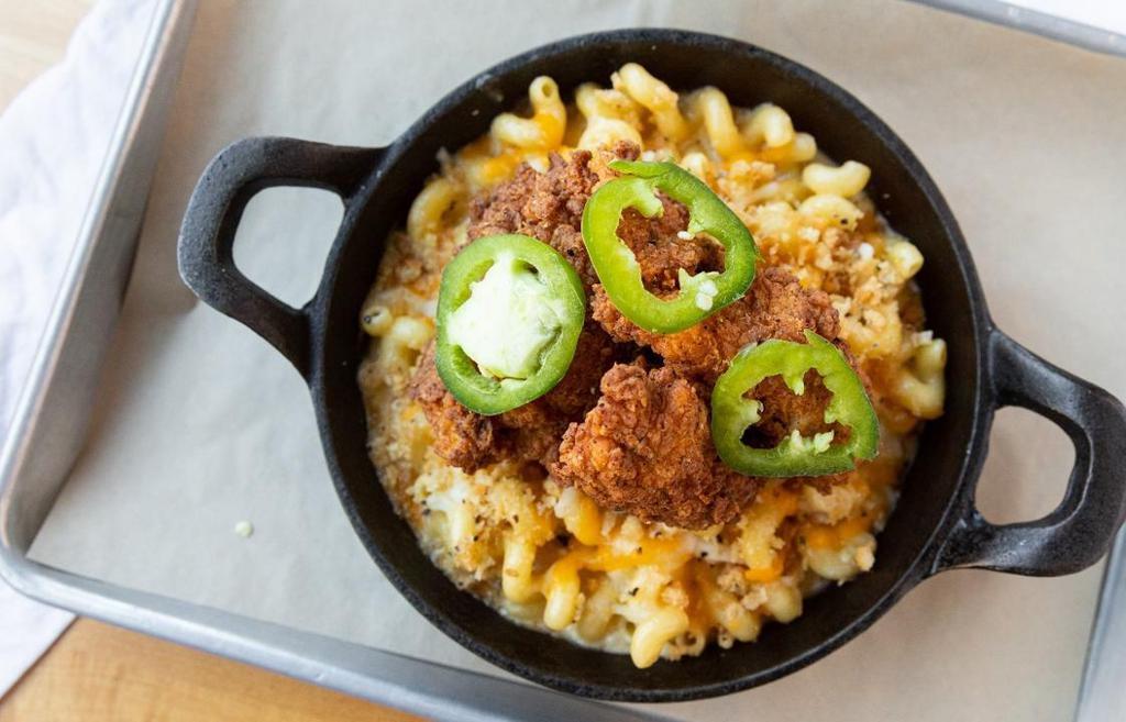 Southern Fried Chicken Mac & Cheese · Cheddar, Jack, Swiss and Parmesan cheese, cavatappi pasta and toasted bread crumbs topped with jalapeño buttermilk fried chicken and garnished with spicy peppers.