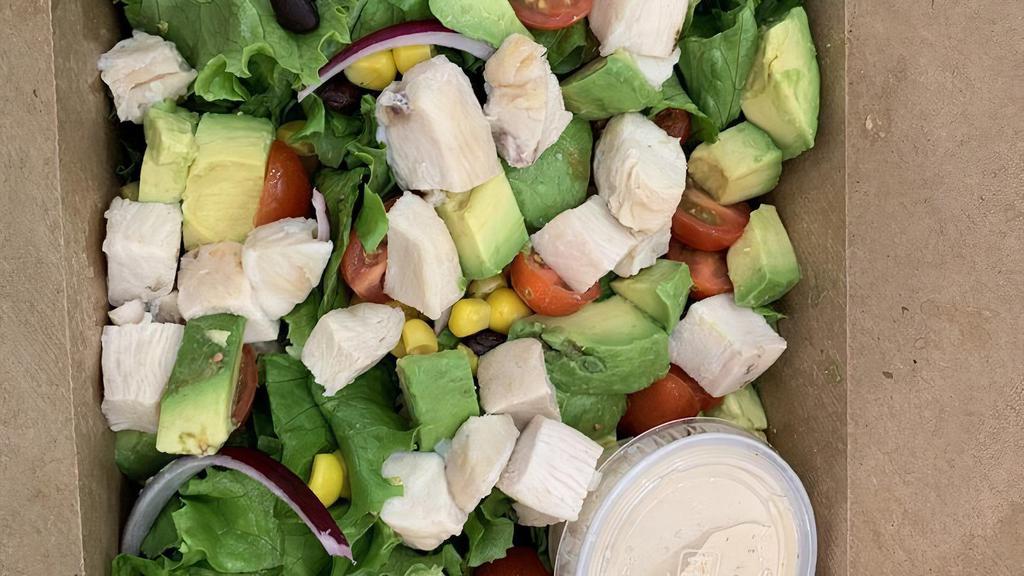 The Southwest Salad · Gluten free. Vegetarian. Green leaf lettuce, grape tomato, black bean, corn, red onion, cheddar, and avocado. Served with chipotle ranch.