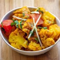 Aloo Gobhi · Potatoes and cauliflower cooked with combination of spices and fresh herbs. NOT SERVED WITH ...