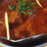 Chicken Vindaloo · Chicken marinated in vinegar and cooked with diced potatoes in a spicy curry sauce. NOT SERV...