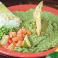 Guacamole Salad · Special recipe guacamole served on a bed of lettuce and tomatoes.