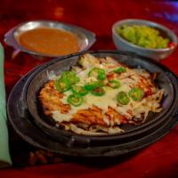 Pechuga La Tana · Grilled Chicken Breast topped with Lots of Serrano Peppers, Garlic and melted Cheese (Served...