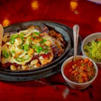Carne Asada La Tana · Filleted Skirt Steak topped  with Lots of Serrano Peppers, Garlic and melted Cheese. Served ...