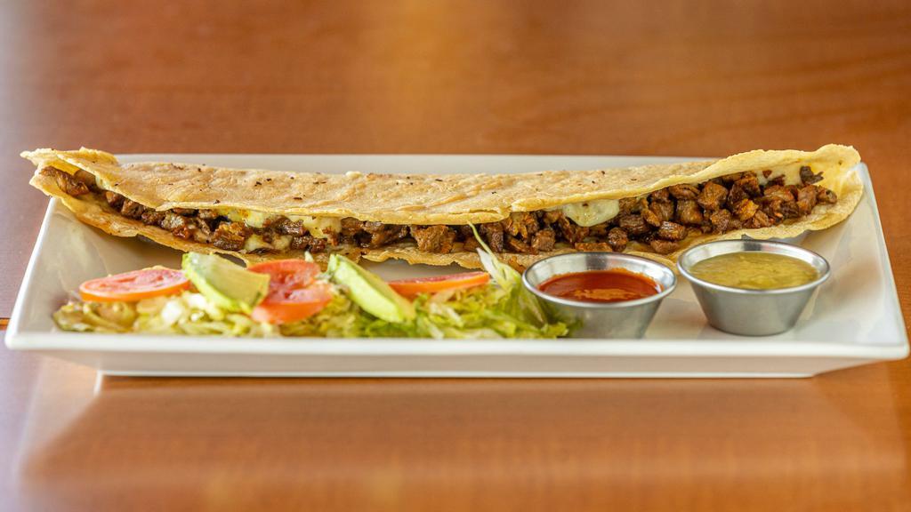 Quesadilla · Carne, lechuga, tomate, aguacate y queso. / Meat, lettuce, tomato, avocado and cheese. Handmade Corn dough, quesadilla filled with cheese and meat served with a salad