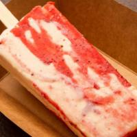 Strawberry Cheesecake Paleta · One of our specialty Paletas! The  Strawberry Cheesecake Paleta is made with fresh strawberr...