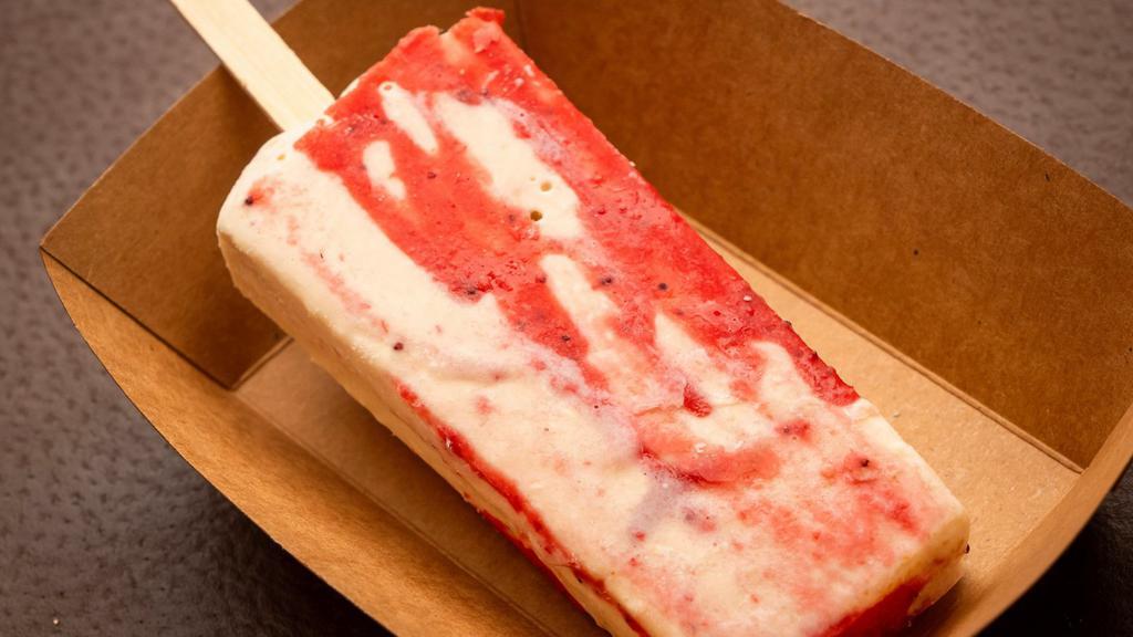 Strawberry Cheesecake Paleta · One of our specialty Paletas! The  Strawberry Cheesecake Paleta is made with fresh strawberries and cheesecake!