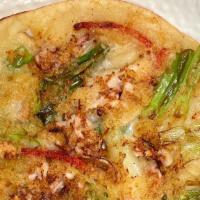 Seafood Pancake (Haemul Pajeon) · Seafood Pancake with shrimp, squid, scallion 
and bell pepper