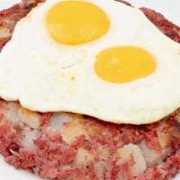 Corned Beef Hash And Eggs · 10 oz. Corned beef, potato, onion, and 2 over easy eggs. Served with choice of side