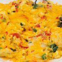 Migas · Scrambled eggs, onion, fresh jalapeno, tomato, tortilla strips, aged Cheddar, and salsa. Ser...