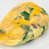Spinach, Cheddar, And Mushroom Omelette · Fresh baby spinach, sauteed mushrooms, and aged Cheddar. With signature French rolled, oven-...