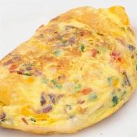 Fiesta Cheddar Omelette · Bacon, onion, jalapeno, tomato, and aged Cheddar. With signature French rolled, oven-baked, ...