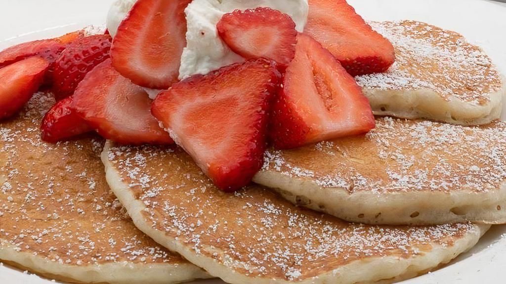 Strawberry Pancake · Served with whipped cream and strawberry syrup