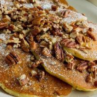 Pecan Pancake · Buttermilk batter filled and topped with roasted pecans and dusted with powdered sugar