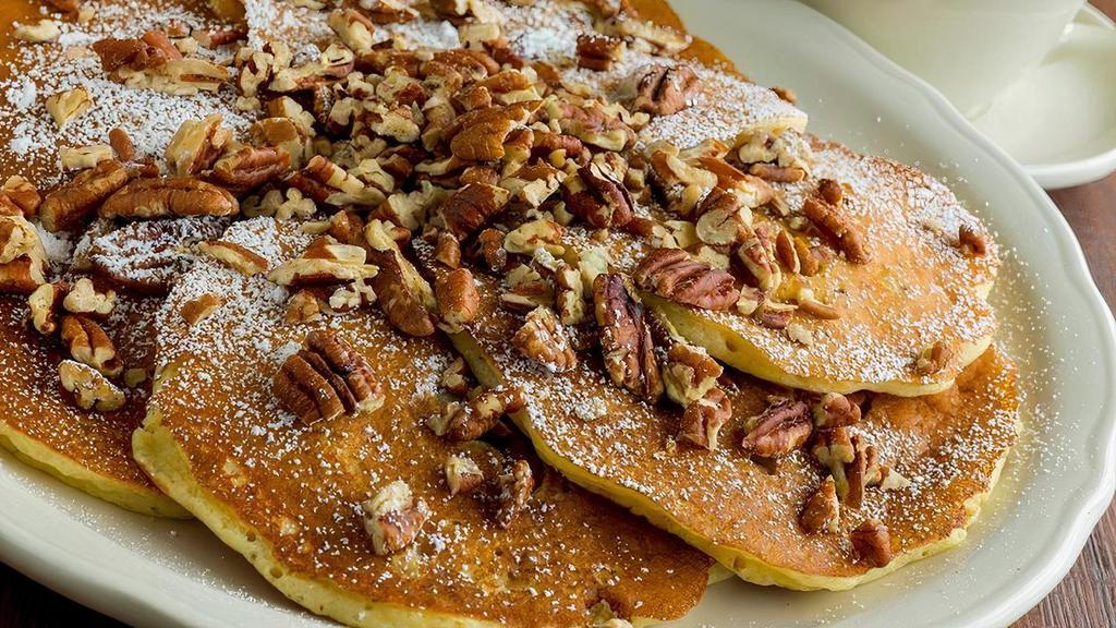Pecan Pancake · Buttermilk batter filled and topped with roasted pecans and dusted with powdered sugar
