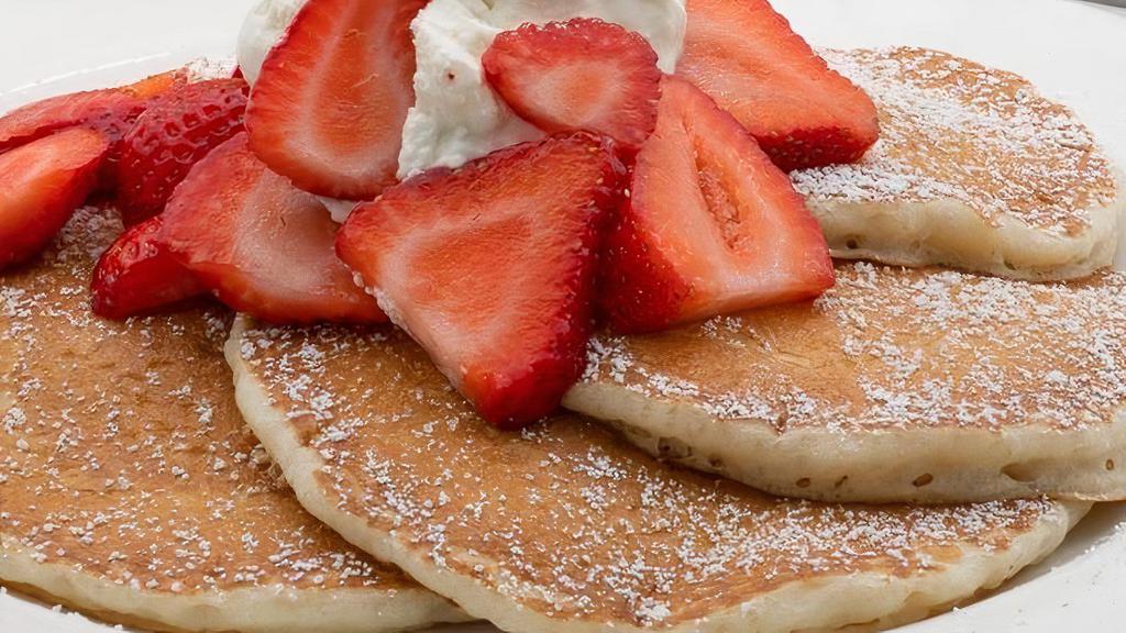Strawberry Pancake - 1/2 · Served with whipped cream and strawberry syrup