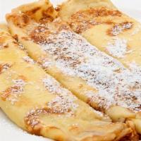 Classic Shell Crepe · 1 crepe lightly dusted with powdered sugar.