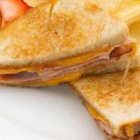 Grilled Ham And Cheese Sandwich · Shaved ham and melted Cheddar on sourdough.