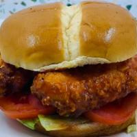 Crispy Chicken Sandwich · Two buffalo chicken tenders, brioche bun, lettuce, tomato, pickles.