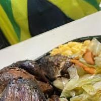 Jerk Chicken Plate · Jerk chicken over basmati rice served with a fresh green salad & home-made Italian dressing.