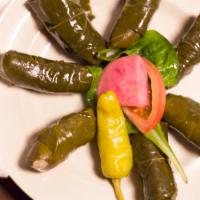 Dolma · This famous Greek appetizer is 6 stuffed grape leaves with rice and served in our own lemon ...