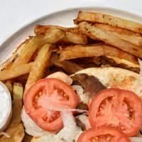 Our Famous Original Gyro With Fries · A blend of lamb and beef wrapped in pita with onions, tomatoes, and our famous tzatziki. Jus...