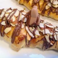 Bunny Chocolate Croissant · Butter croissant topped with a chocolate bunny and almonds.