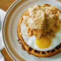 Chicken & Waffle · bacon-laced malted waffle, crispy chicken tenders, sunny up local eggs, maple syrup, house c...