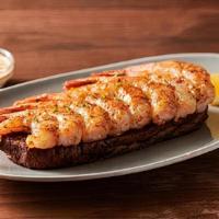 Grilled Shrimp On The Barbie · Seasoned with a special blend of herbs and spices then flame grilled. Served with Outback’s ...