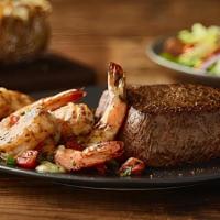 Sirloin & Shrimp On The Barbie · Our signature center-cut sirloin with Grilled Shrimp on the Barbie. Served with two freshly ...